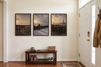 The Long Way Home framed prints hung in a front entry