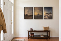 By Land, Sea, and Air framed prints hung in a front entry