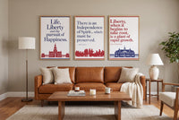 Words of Liberty framed prints hung above a sofa in a living room