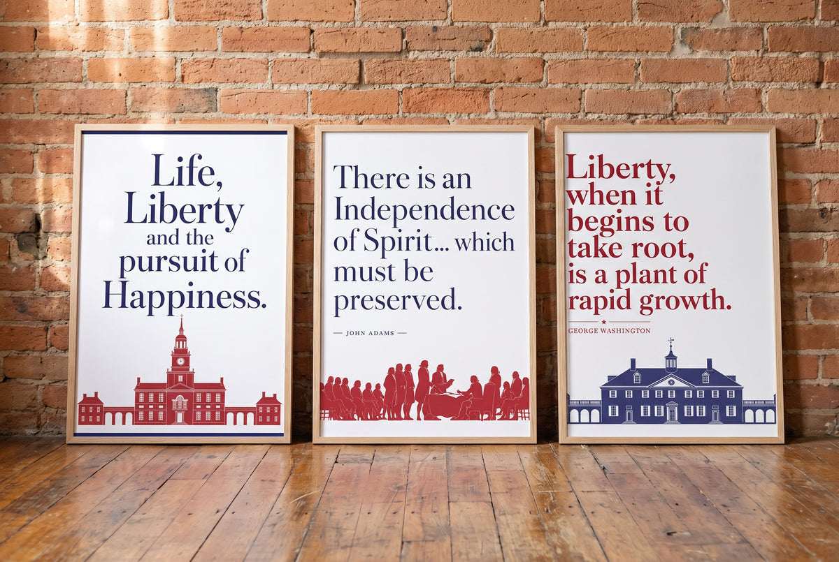 Words of Liberty framed prints leaning against a brick wall