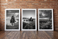 Wranglers framed prints leaning against a brick wall