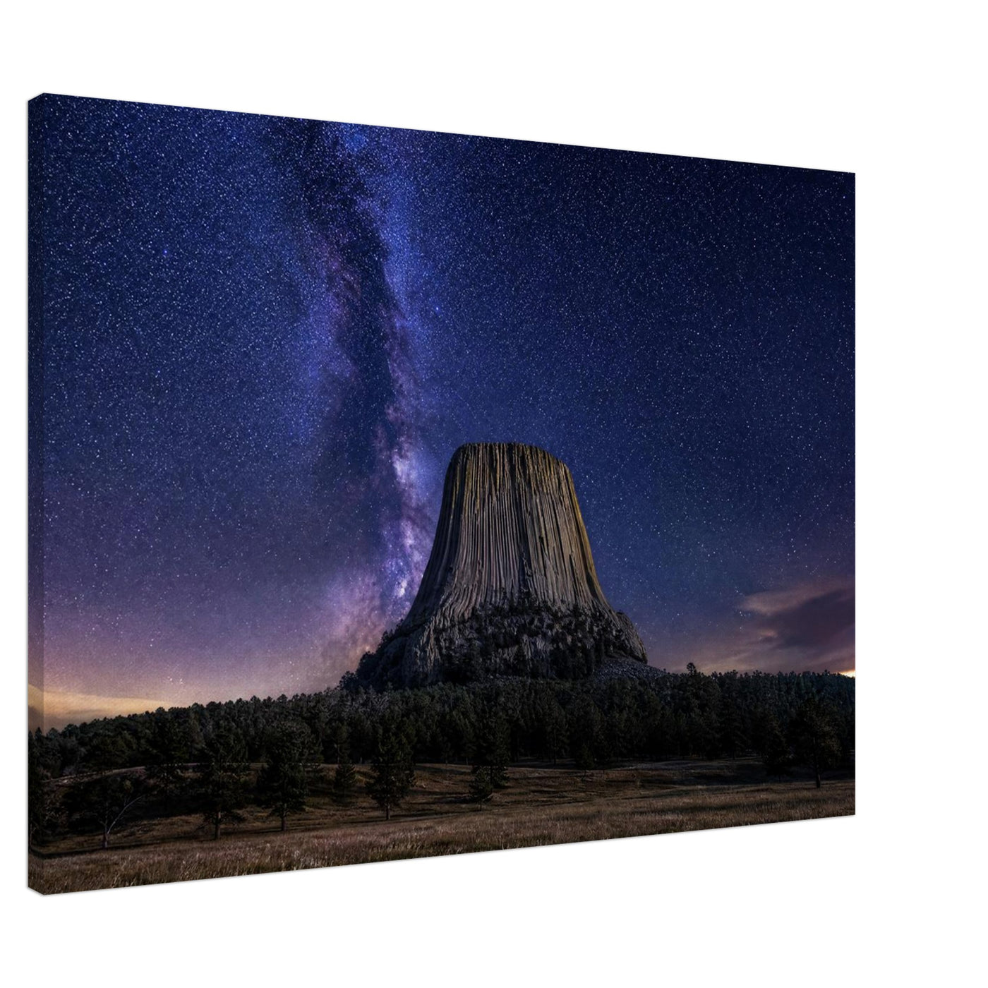 Canvas print of Devils Tower under the Milky Way — room view, ready to hang.