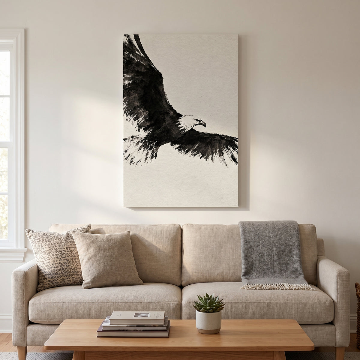 Ink Wing – bald eagle in flight painted in black ink on warm paper, patriotic canvas wall art above a linen sofa in a living room