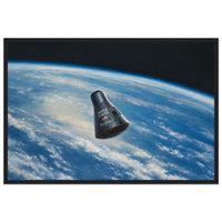 Framed panoramic art print of the Friendship 7 capsule orbiting Earth against the black of space, in a solid wood frame.