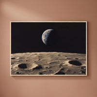 Earthrise framed print on a plain wall