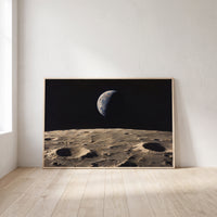 Earthrise framed print leaning against a wall