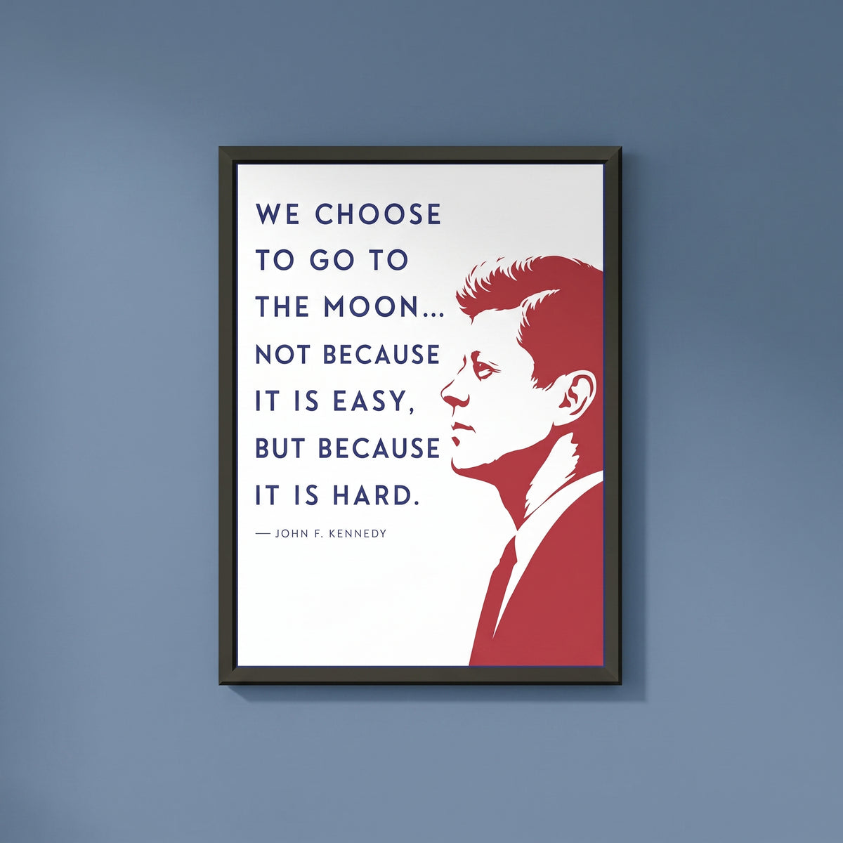 John F. Kennedy — We Choose to Go to the Moon framed print on a plain wall