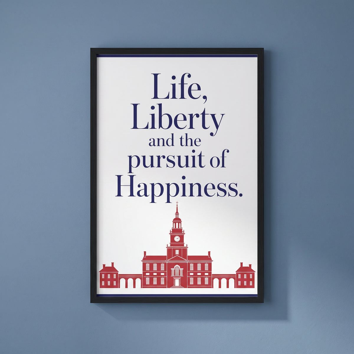 Life, Liberty & the Pursuit of Happiness framed print on a plain wall