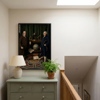The Ambassadors framed print hanging in a home interior