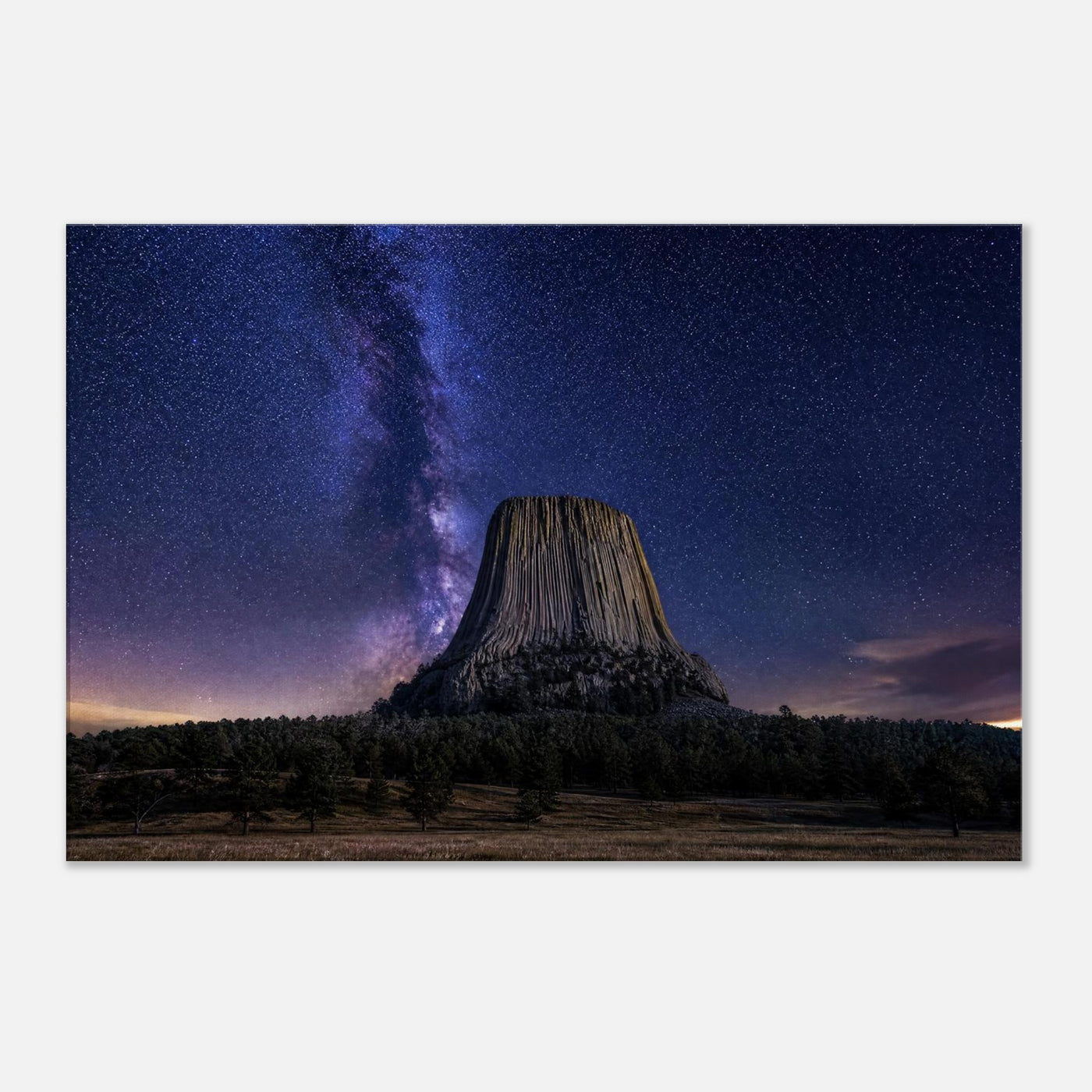 Canvas print of Devils Tower under the Milky Way — room view, ready to hang.