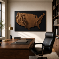 America in Relief map print, 36x24 inch, shown above a walnut desk in a refined modern home office.