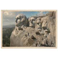 Framed panoramic art print of workers carving the presidential faces of Mount Rushmore, in a solid wood frame.