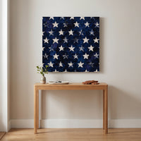 Fifty Stars – fifty white stars on a midnight navy ground, patriotic canvas wall art above an oak console in an entryway