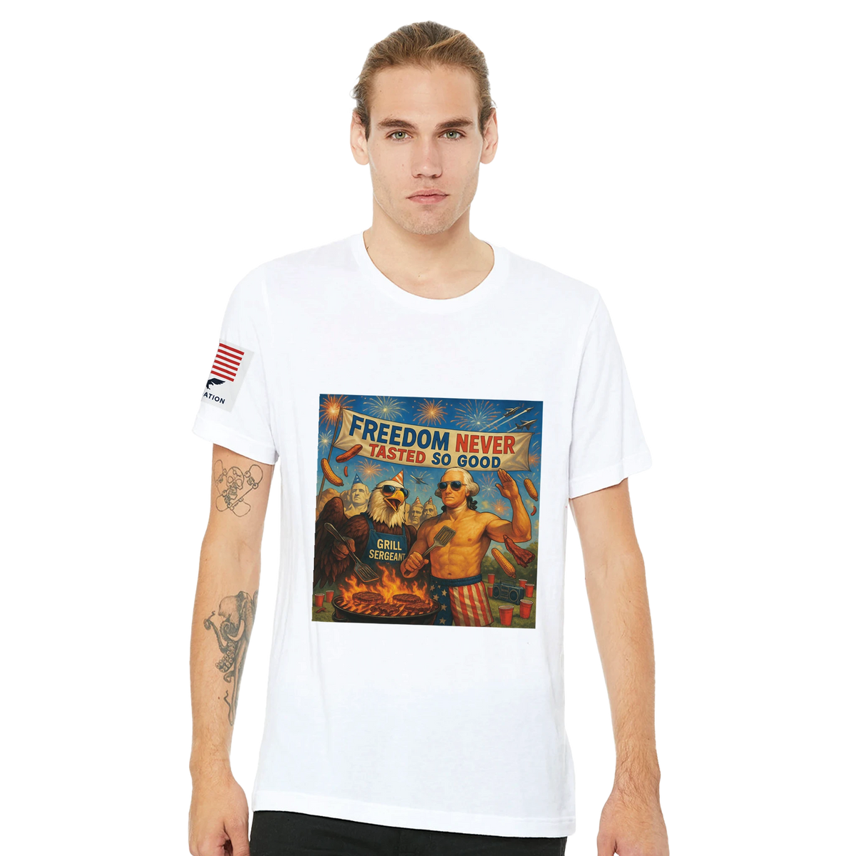 Freedom Never Tasted so Good - BBQ T-Shirt — T-shirt of a white t-shirt with a shirtless colonial-wigged man and bald eagle grilling under fireworks