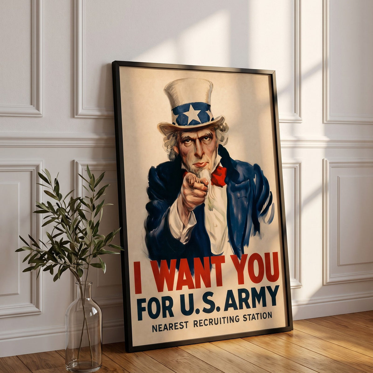 I Want You framed print leaning against a white paneled wall