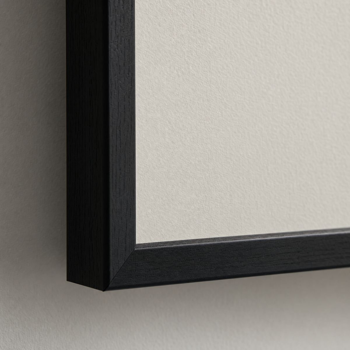 Close-up of the matte museum fine-art paper surface and the slim black frame edge.