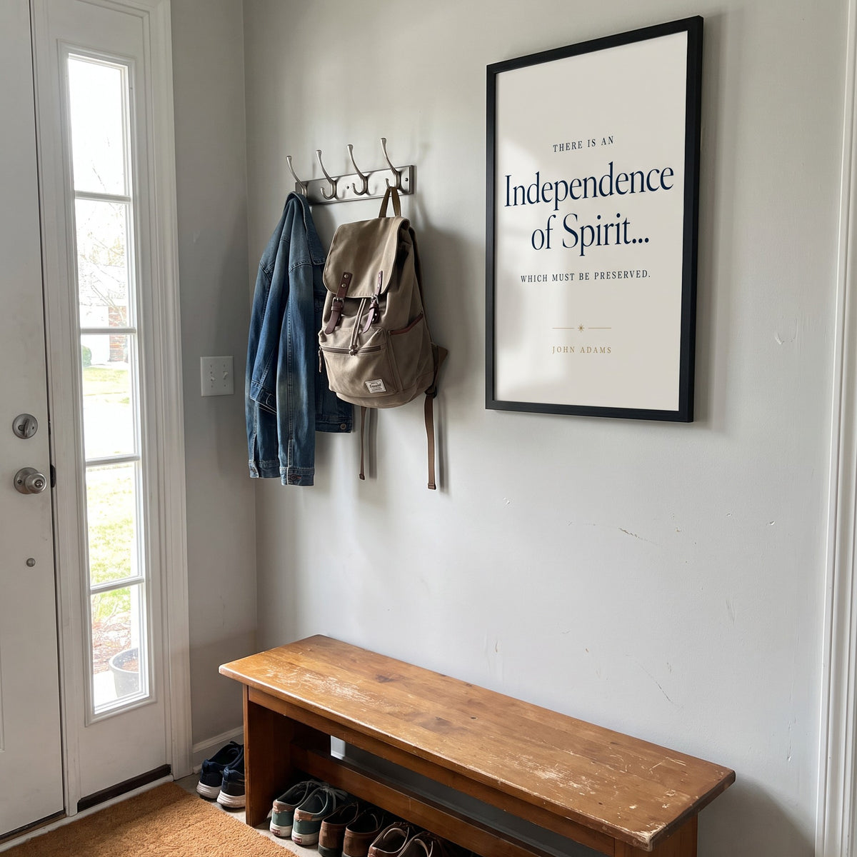 Independence framed print above an entryway bench