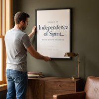 Man hanging the Independence framed print on the wall