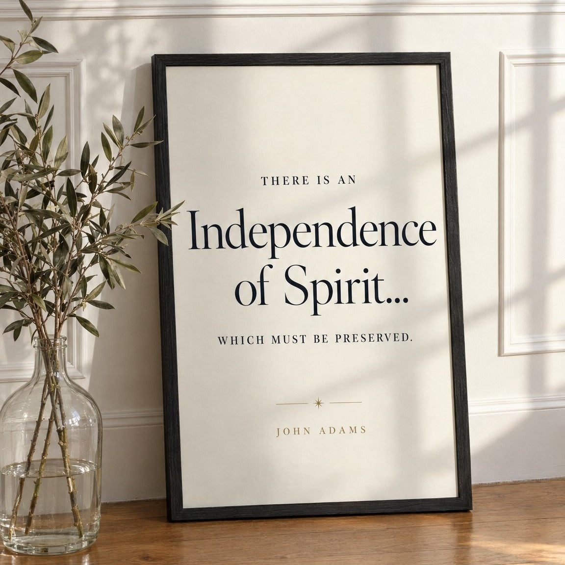 Independence framed print leaning against a white paneled wall