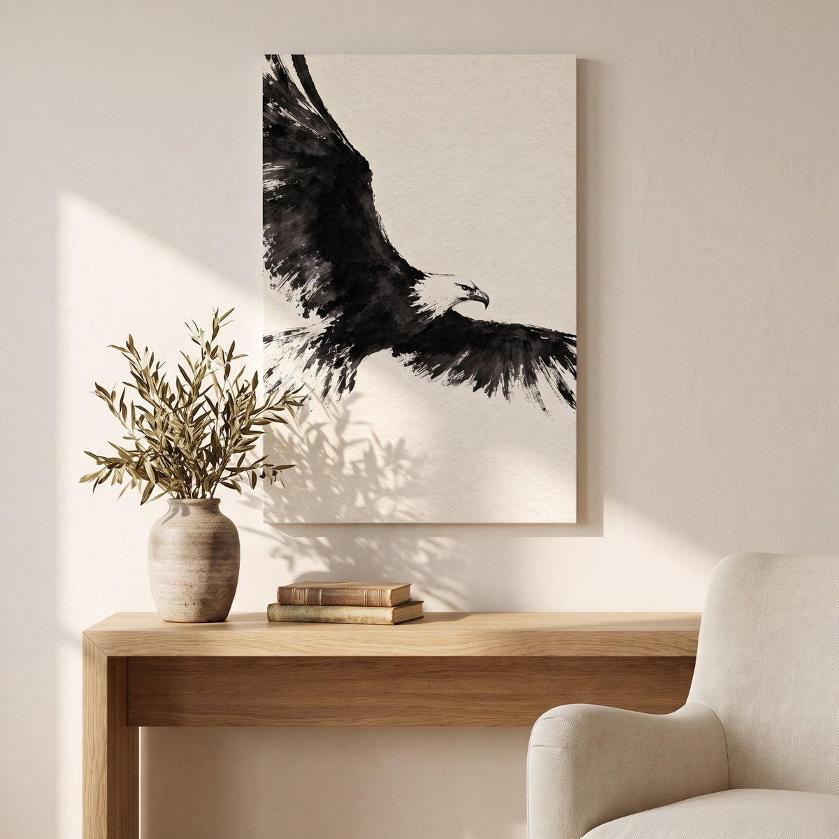 Ink Wing canvas above a wooden console table