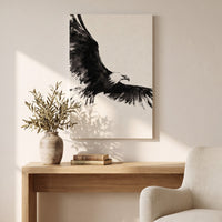 Ink Wing canvas above a wooden console table