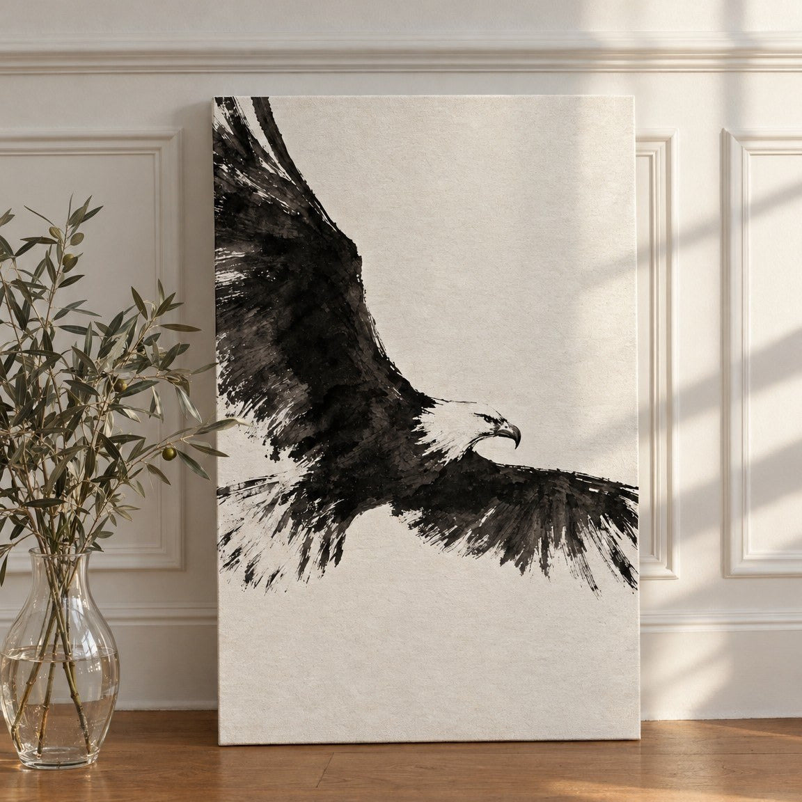Ink Wing canvas leaning against a white paneled wall