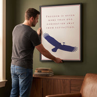 Man hanging the One Generation Away framed print on the wall