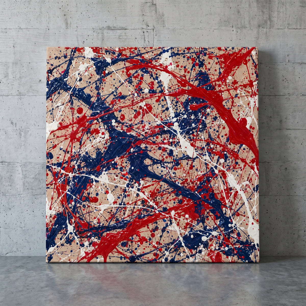 Poured Colors – red, white and blue paint poured and flung across raw linen, patriotic canvas wall art leaning against a concrete wall