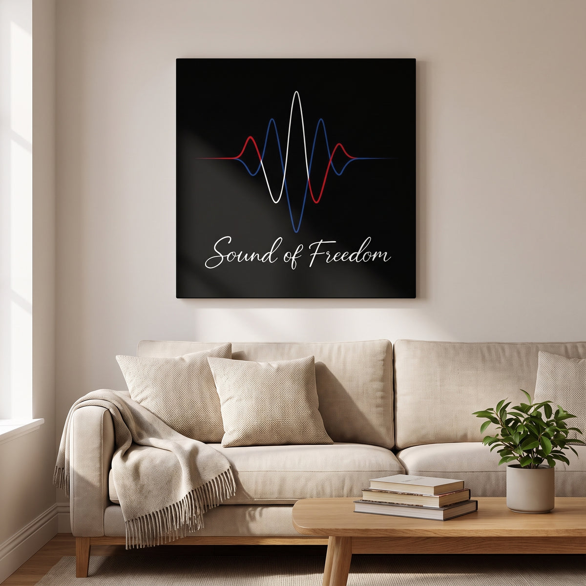 Sound of Freedom – red, white and blue sound wave over script lettering on black, patriotic canvas wall art above a linen sofa in a living room