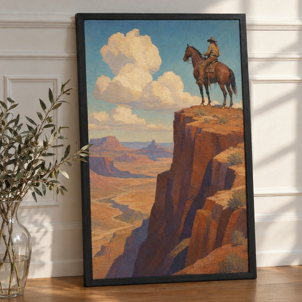Rider on the Range framed print leaning against a white paneled wall