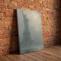 Liberty in Fog – the Statue of Liberty in harbor fog with the torch lit, patriotic canvas wall art leaning against a red brick wall