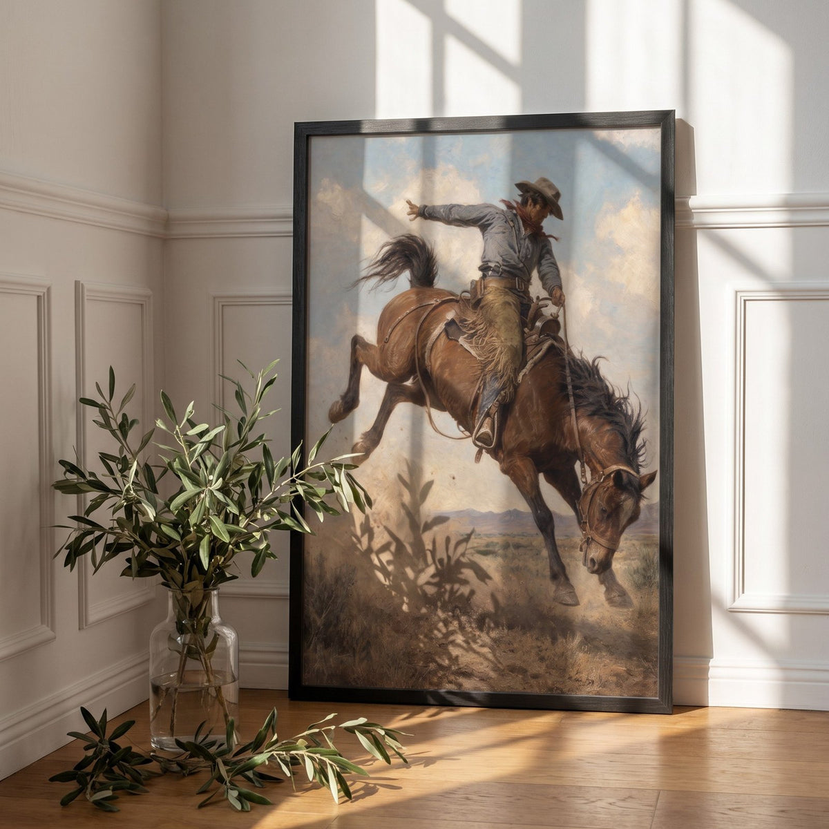 The Bronco Buster framed print leaning against a white paneled wall