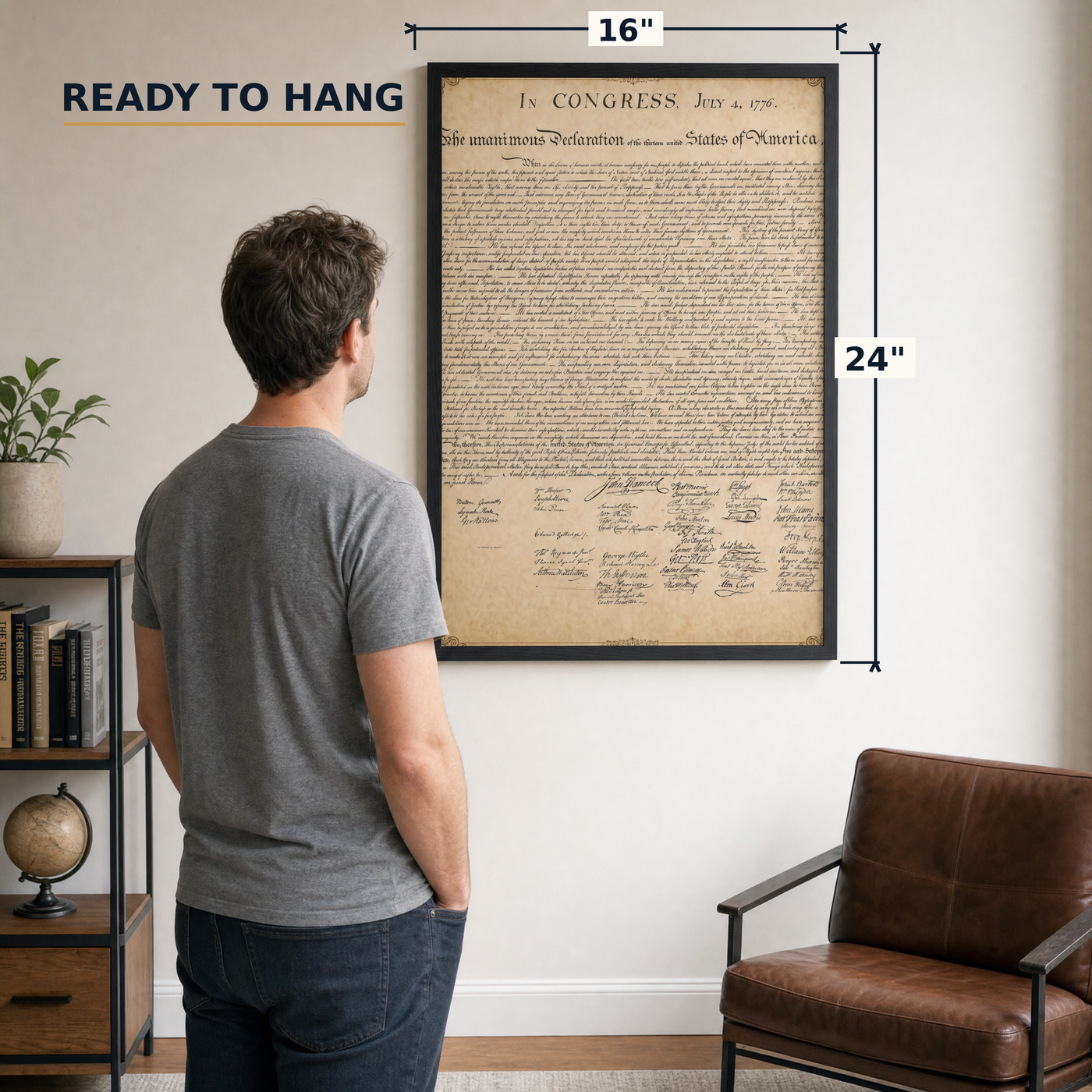The Declaration of Independence framed print, 16x24 inch, shown beside a man for scale — ready to hang out of the box.