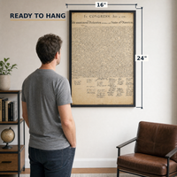 The Declaration of Independence framed print, 16x24 inch, shown beside a man for scale — ready to hang out of the box.