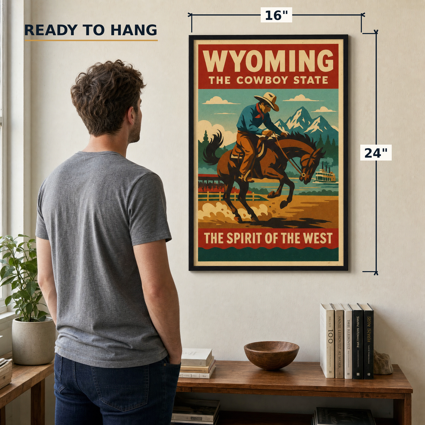 Wyoming travel-poster print, 16x24 inch, shown beside a man for scale — ready to hang out of the box.